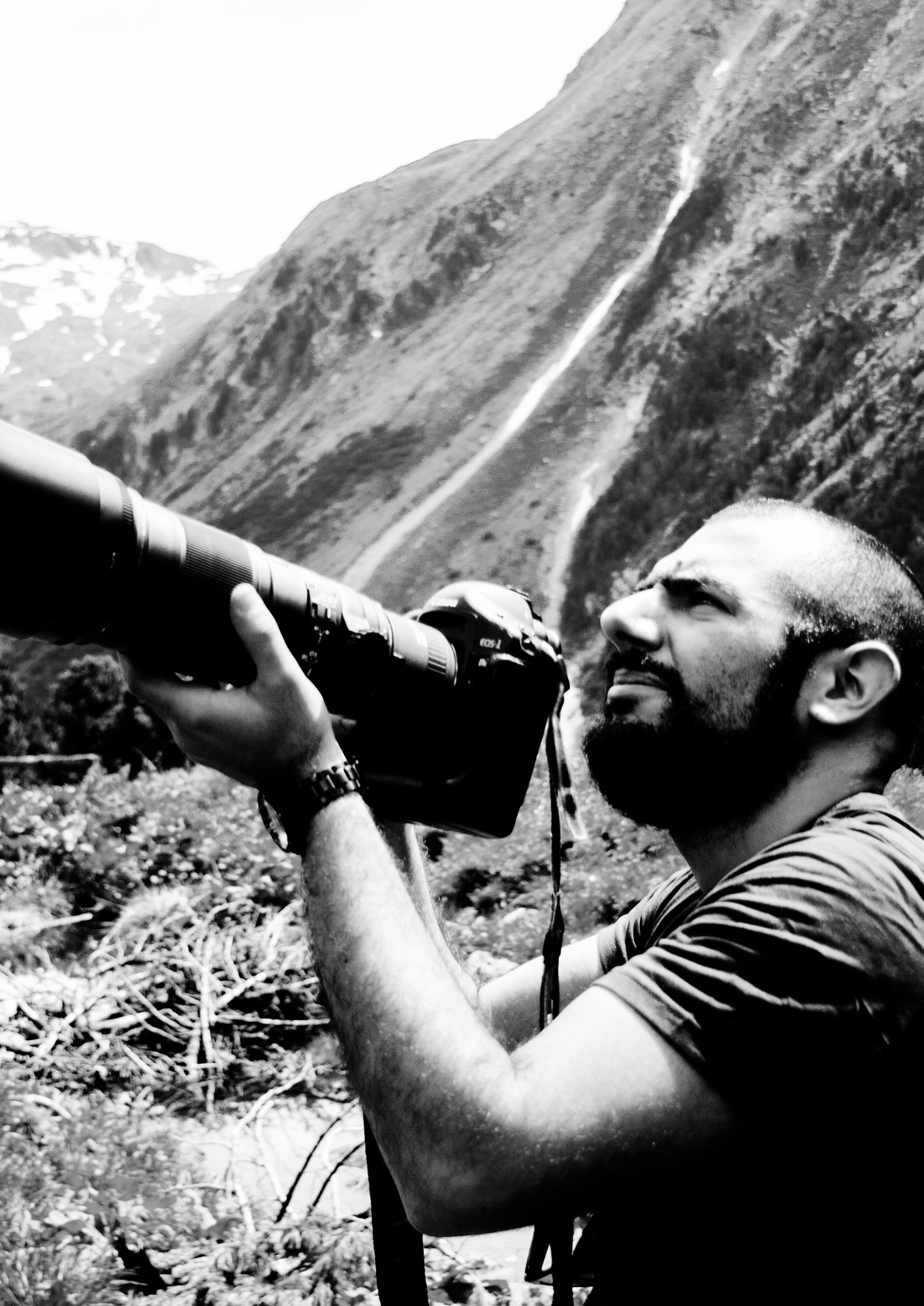 Portrait of site owner in black and white while taking a picture
